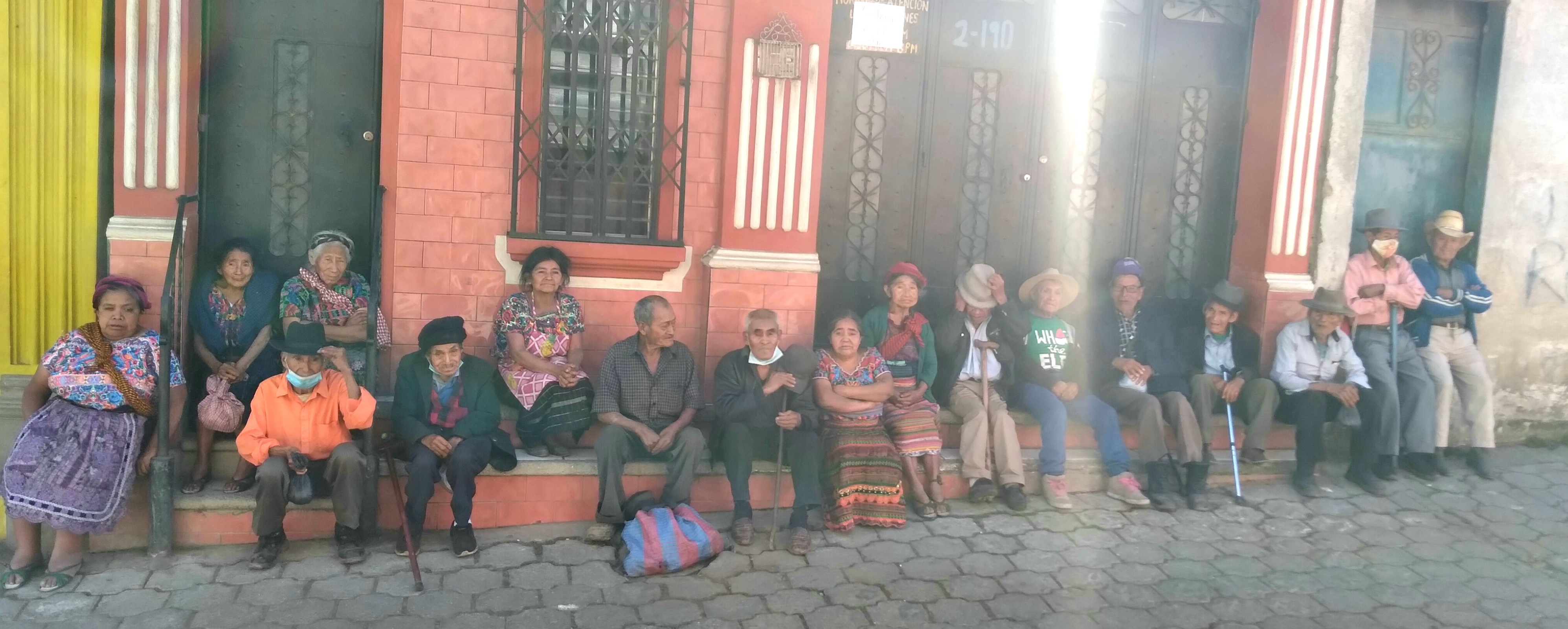 Elderly in Guatemala sitting by the street.