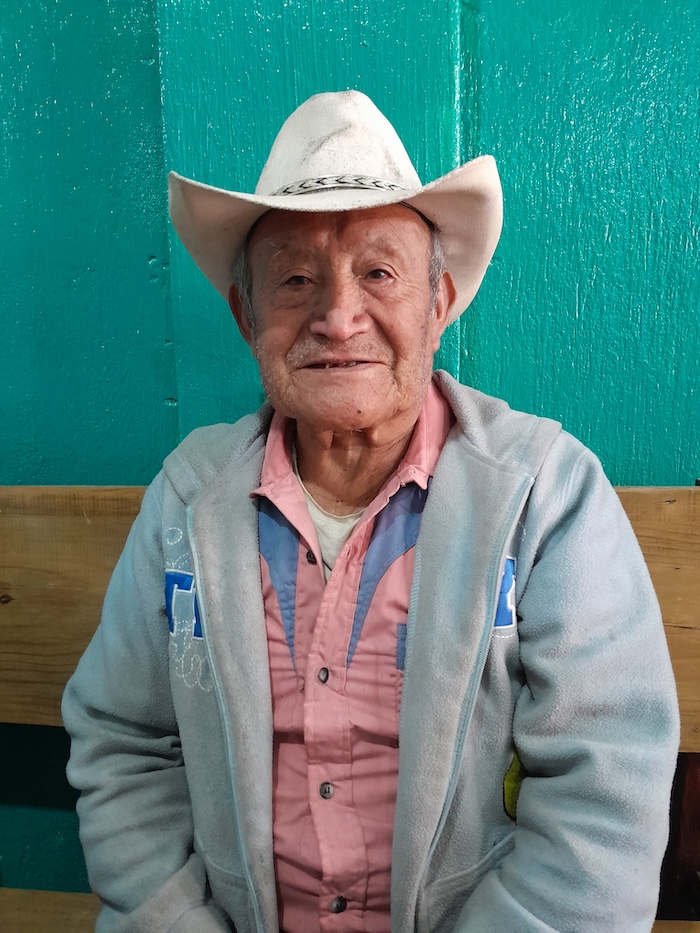 An older man in a cowboy hat.